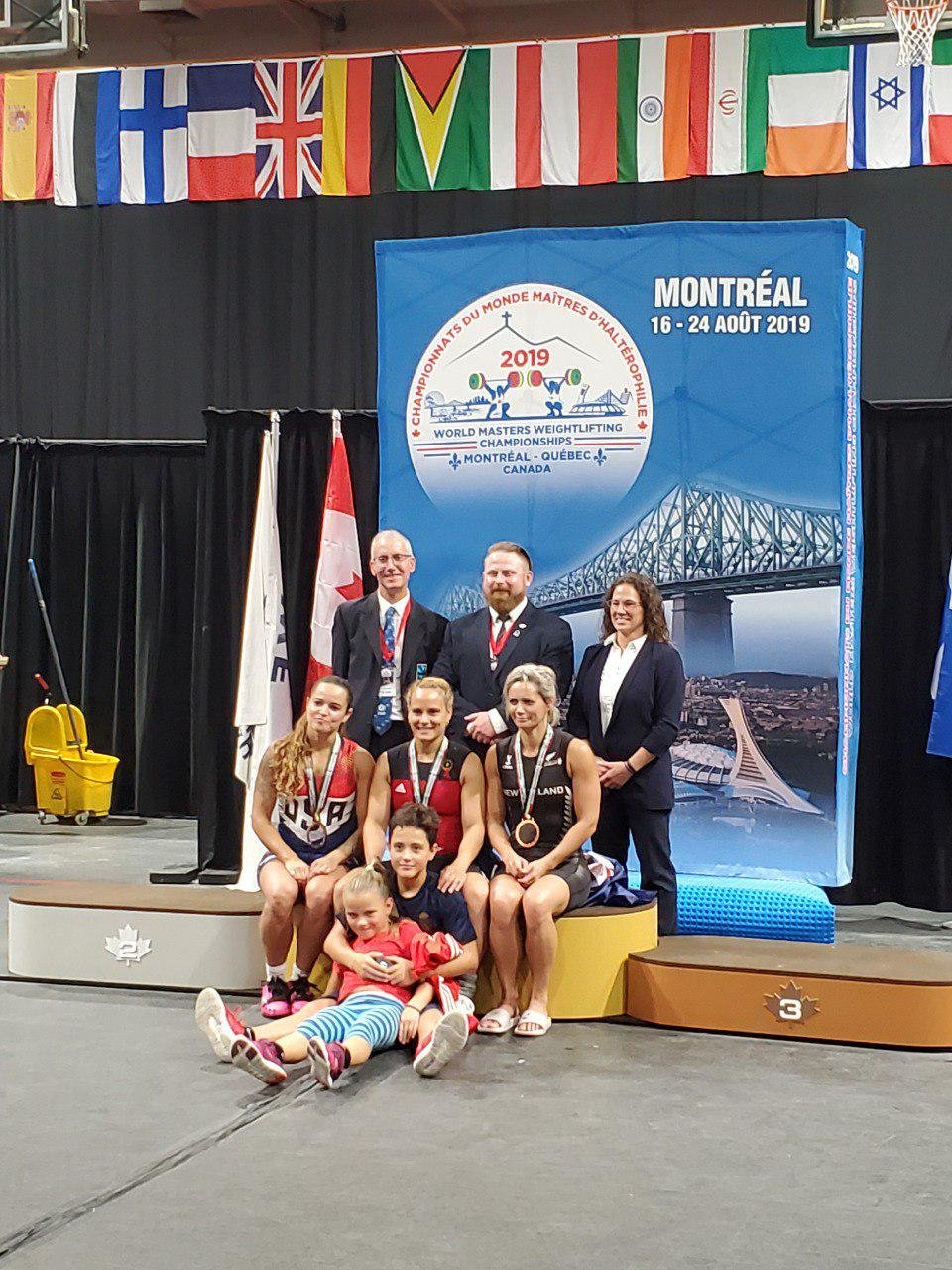 The podium with the judges and Emily & Brayan